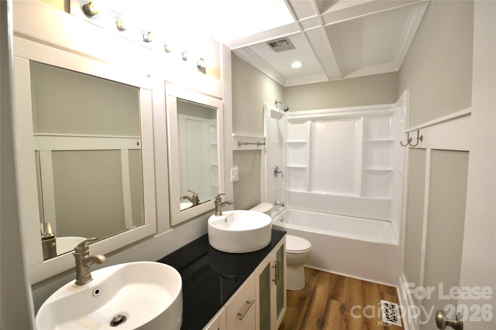 1422 Thermal Road Charlotte, NC 28212 - Photo 19 of 40 a bathroom with a sink and a mirror