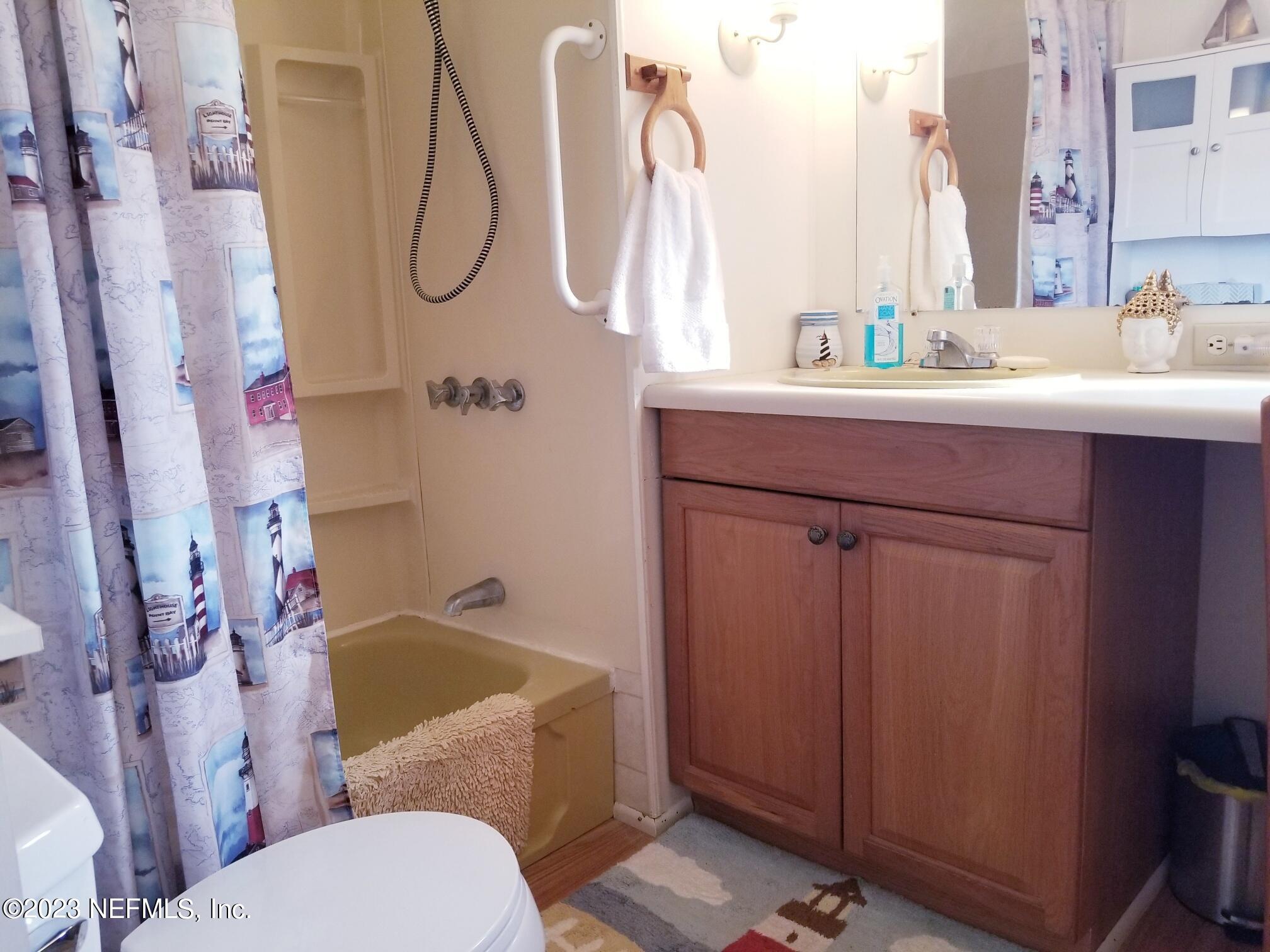 116 Douglas Street Crescent City, FL 32112 - Photo 11 of 26 a bathroom with a sink a toilet and shower