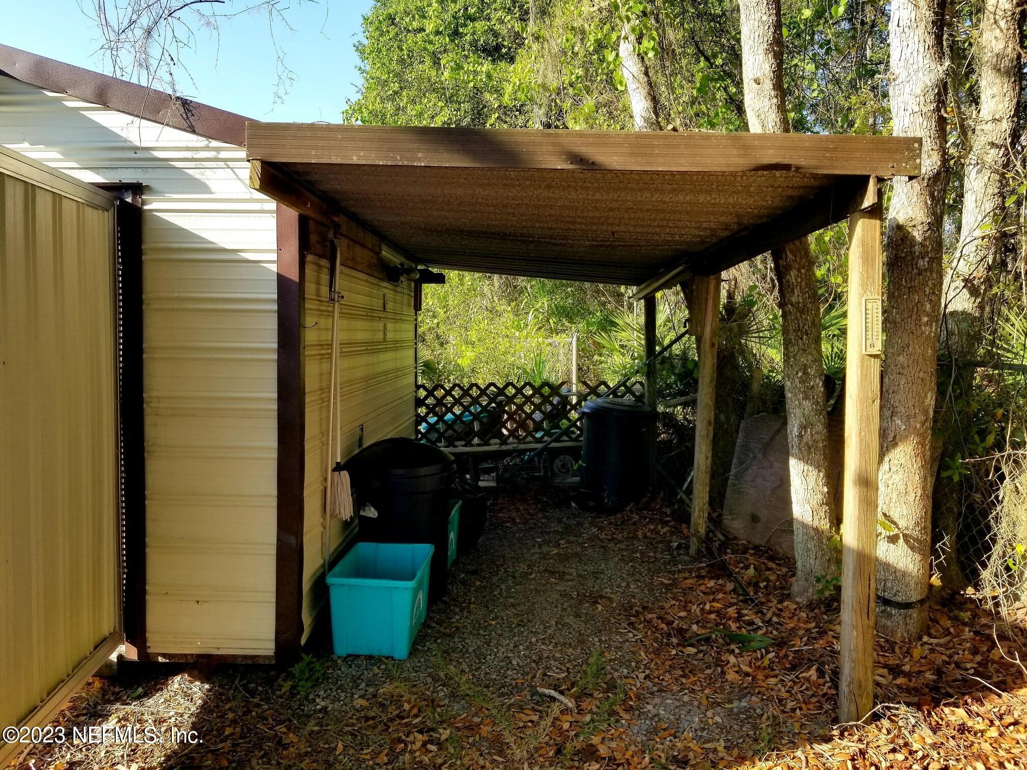 116 Douglas Street Crescent City, FL 32112 - Photo 17 of 26 a view of a couches in the patio next to a yard