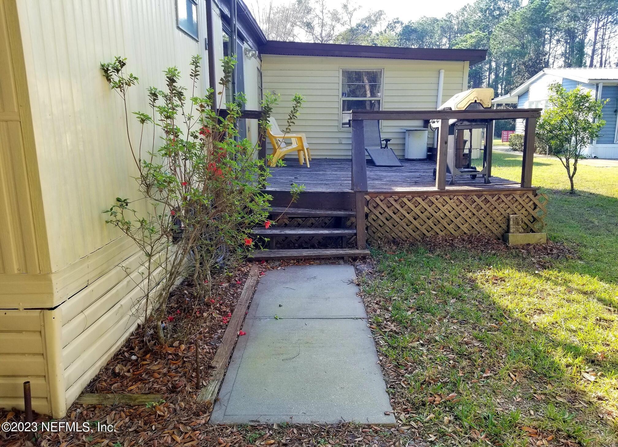 116 Douglas Street Crescent City, FL 32112 - Photo 18 of 26 a view of house with patio