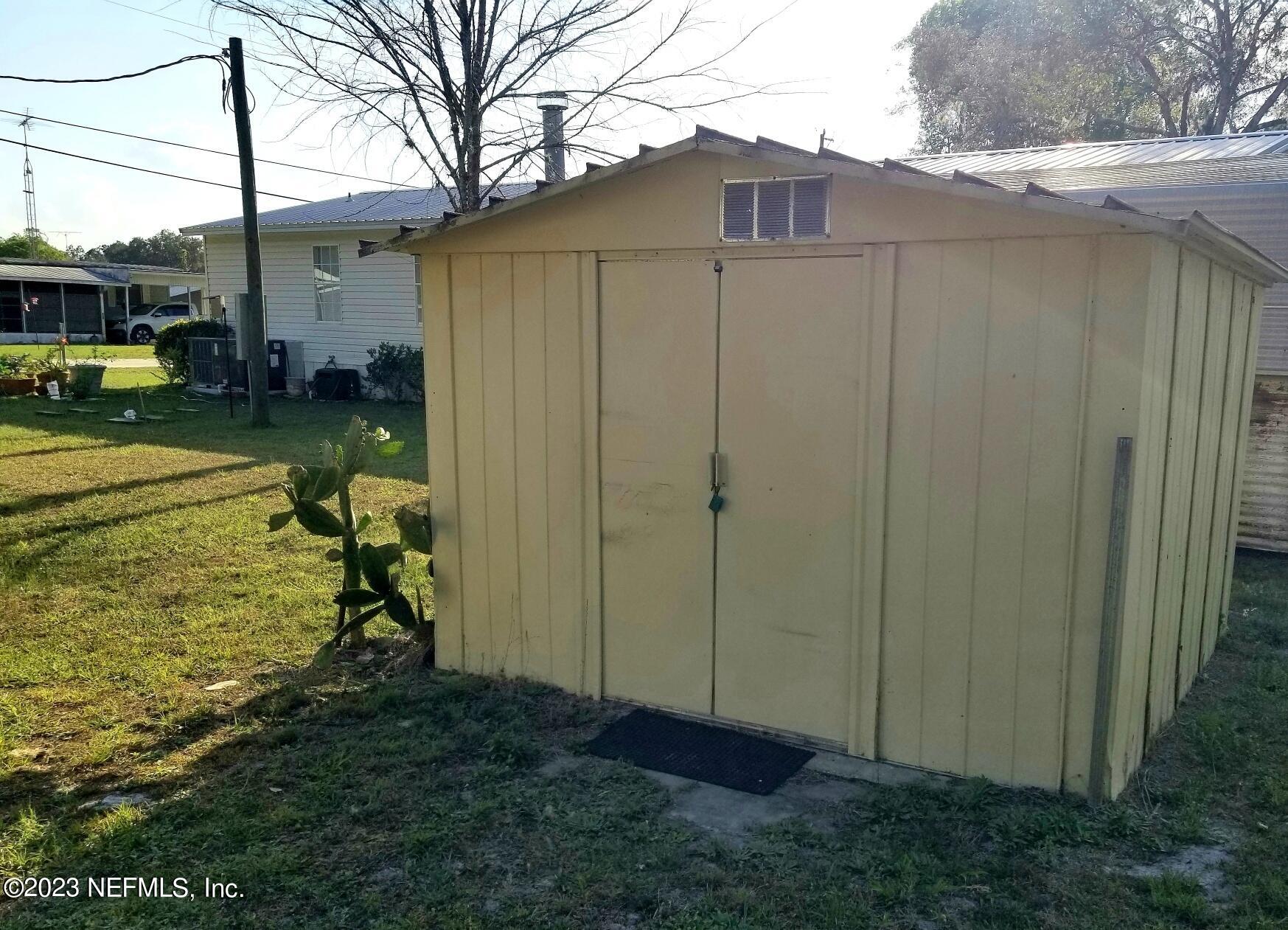 116 Douglas Street Crescent City, FL 32112 - Photo 20 of 26 a view of back yard of the house