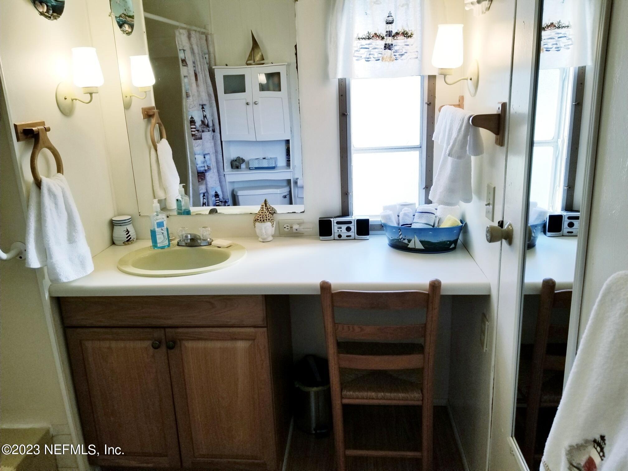 116 Douglas Street Crescent City, FL 32112 - Photo 10 of 26 a bathroom with a sink double vanity and a mirror