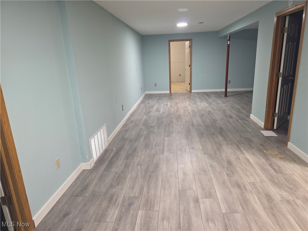 2291 Armstrong Road Wooster, OH 44691 - Photo 14 of 23 Unfurnished room with baseboards and wood finished floors
