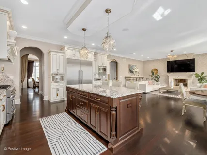 a kitchen with stainless steel appliances granite countertop a stove and cabinets
