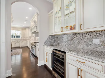 a kitchen with granite countertop a stove and a sink