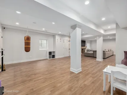 a view of kitchen with furniture and wooden floor
