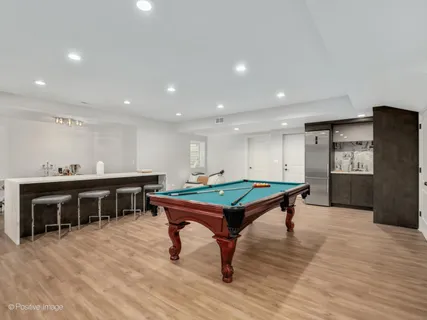 a room with wooden floor furniture and windows