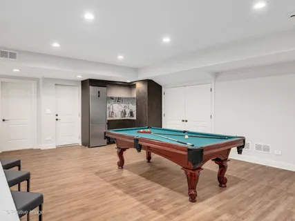 a room with wooden floor and furniture