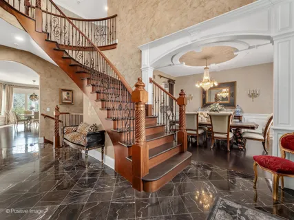 a view of entryway dining room and hall with wooden floor