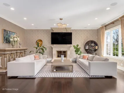 a living room with fireplace furniture and a flat screen tv