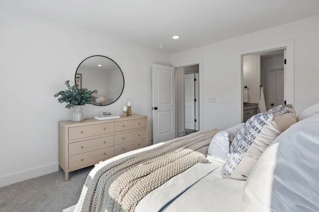 a bathroom with double vanity sinks and a mirror