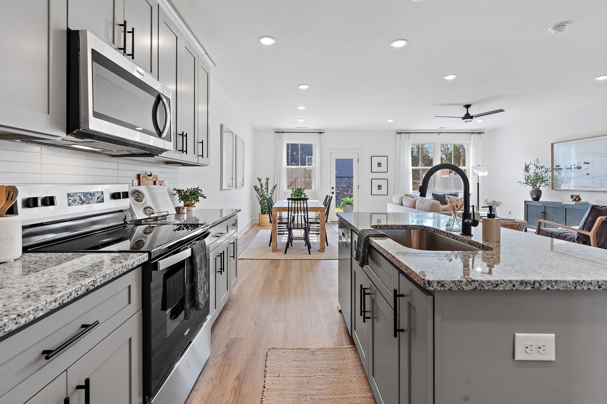 3611 Simba Lane Murfreesboro, TN 37127 - Photo 5 of 30 a kitchen with granite countertop stainless steel appliances a sink a stove top oven a counter space and cabinets