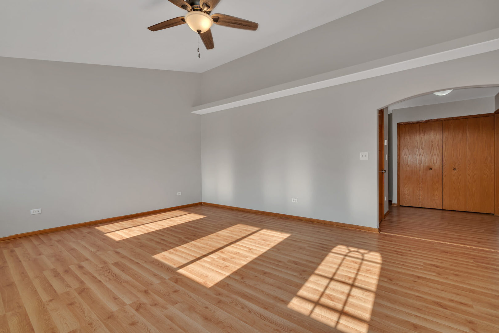 1747 Waters Edge Drive Minooka, IL 60447 - Photo 4 of 11 wooden floor in an empty room with a window