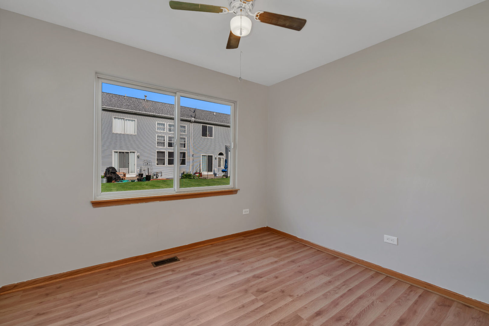 1747 Waters Edge Drive Minooka, IL 60447 - Photo 7 of 11 a living room with wooden floor and ceiling fan