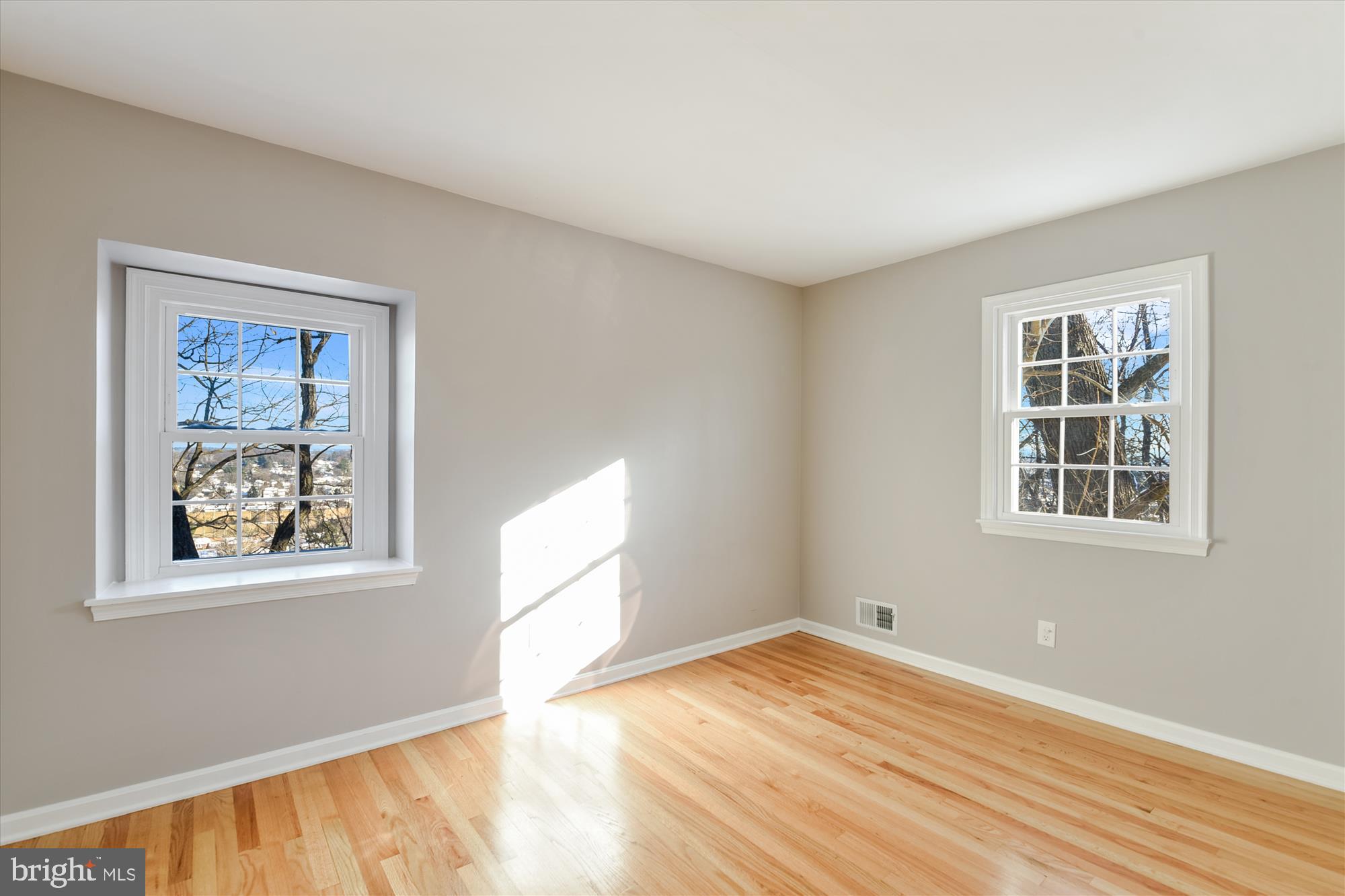 1006 West Joppa Road Towson, MD 21204 - Photo 25 of 47 a view of empty room with wooden floor and fan