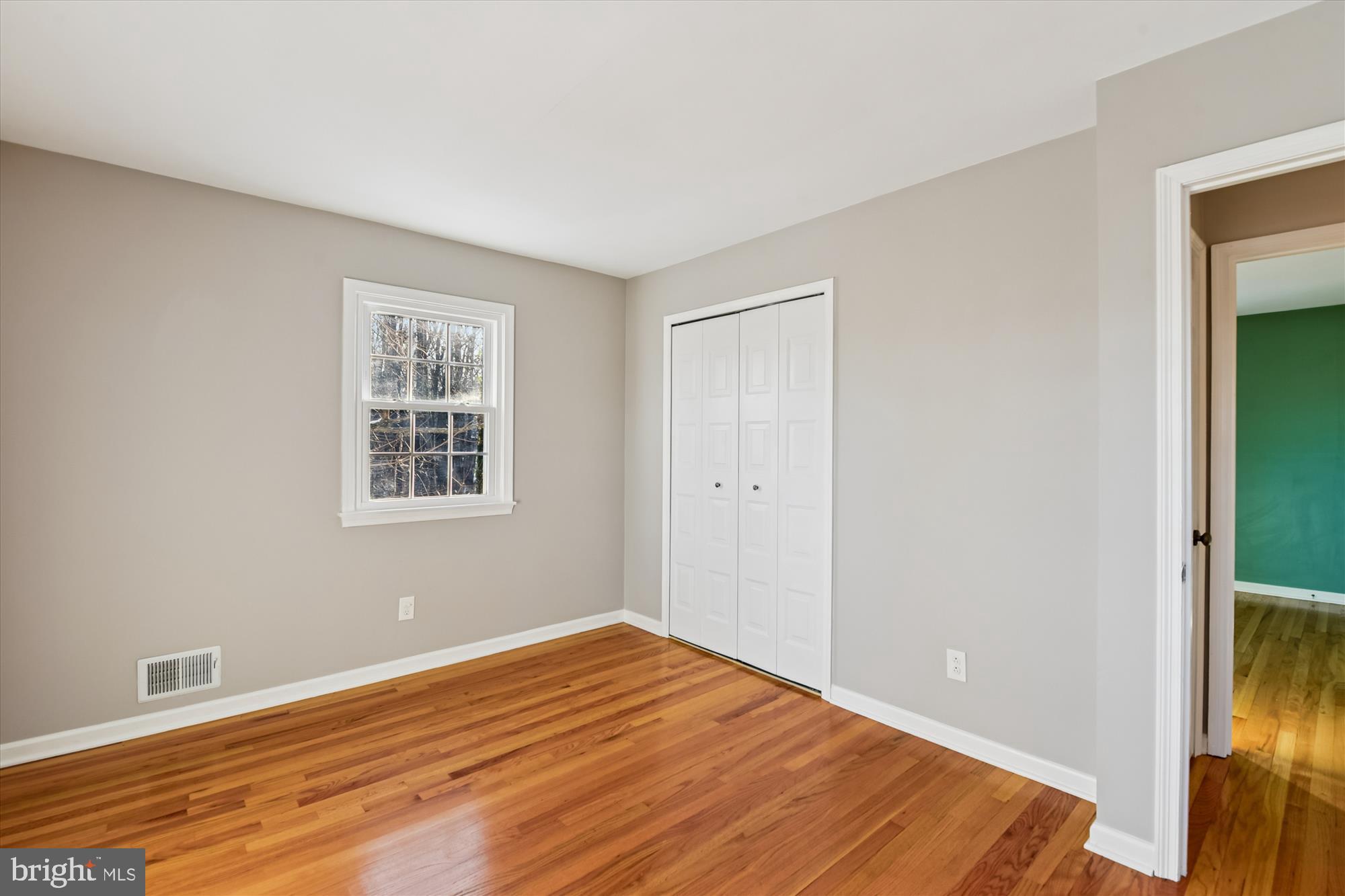 1006 West Joppa Road Towson, MD 21204 - Photo 26 of 47 a view of empty room with wooden floor and fan