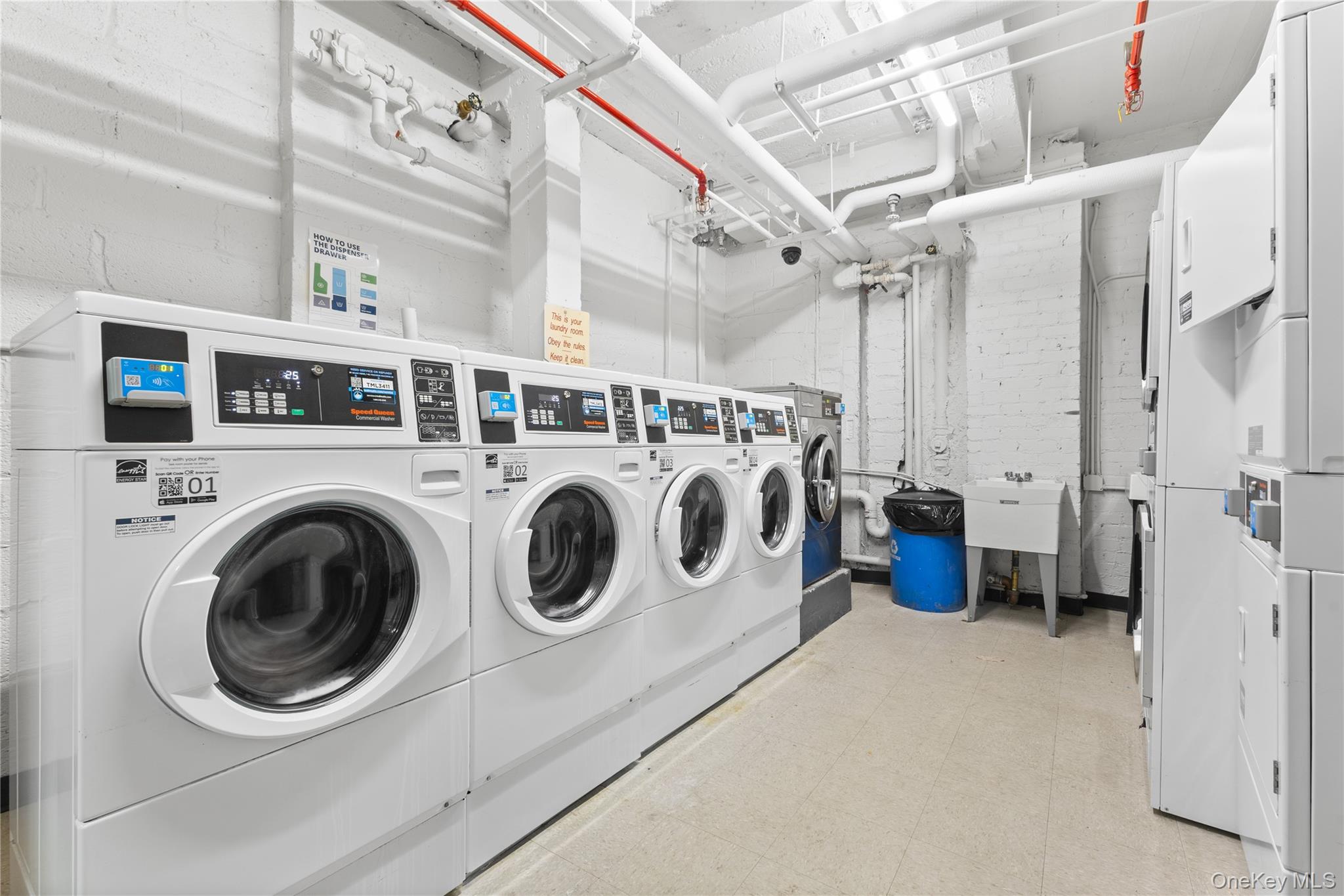 64-11 99th Street, Unit 3O4 Queens, NY 11374 - Photo 22 of 23 Shared laundry room with separate washer and dryer