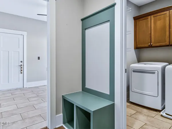 a view of kitchen island with stainless steel appliances wooden floor and counter space