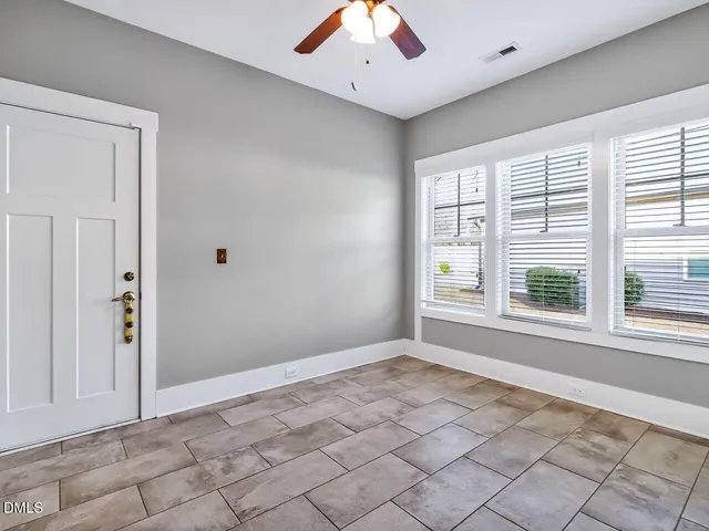 a view of an empty room with a window