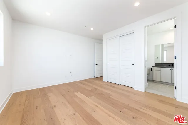 a view of a room with wooden floor and a bridge