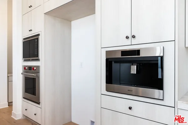 a kitchen with a stove and a sink