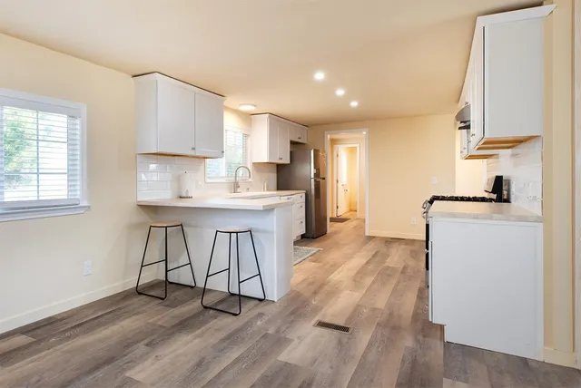 a view of an outdoor space with wooden floor