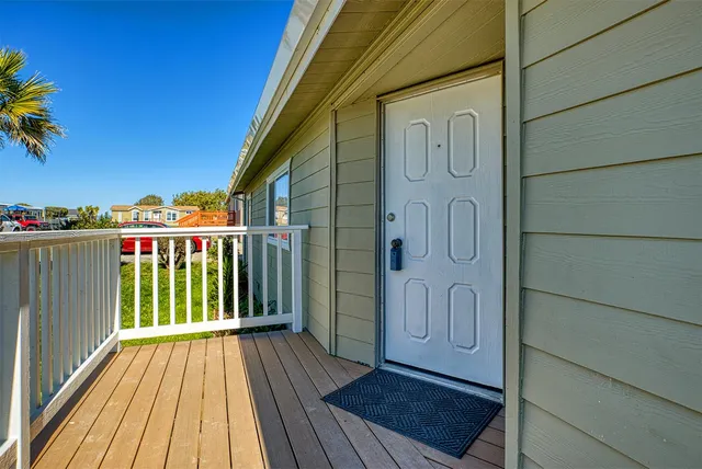 a balcony with wooden floor