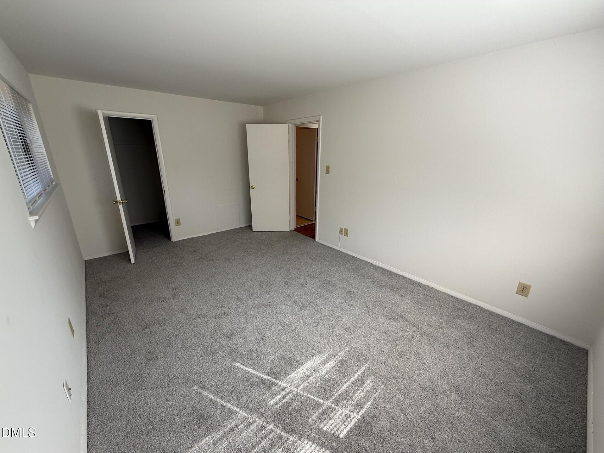 1299 Schaub Drive, Unit D Raleigh, NC 27606 - Photo 10 of 16 a view of an empty room