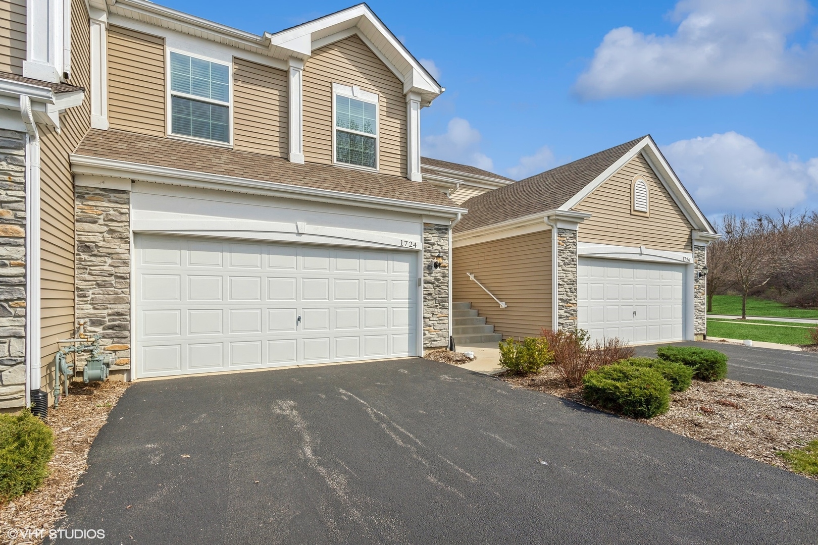 a front view of a house with a garage