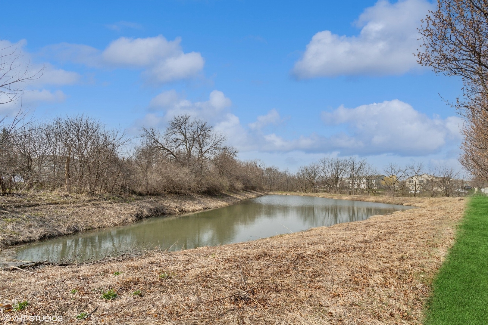 1724 Fredericksburg Lane Aurora, IL 60503 - Photo 19 of 20 a view of a lake with a city