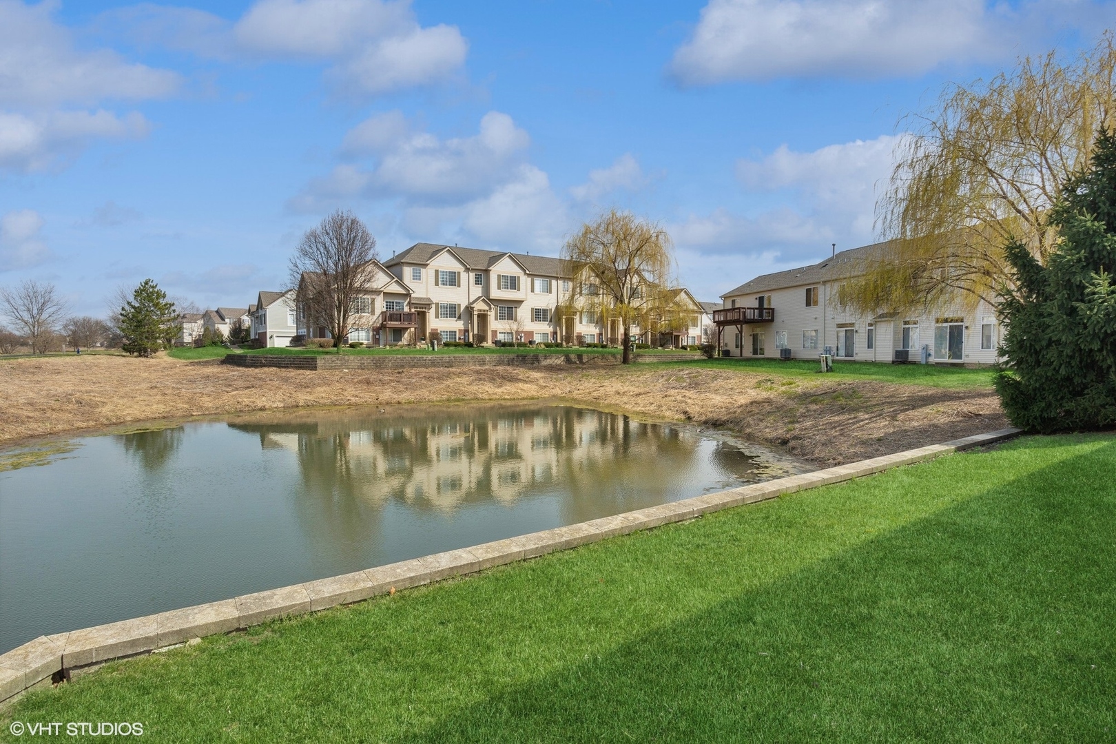 1724 Fredericksburg Lane Aurora, IL 60503 - Photo 20 of 20 a view of a lake with a big yard