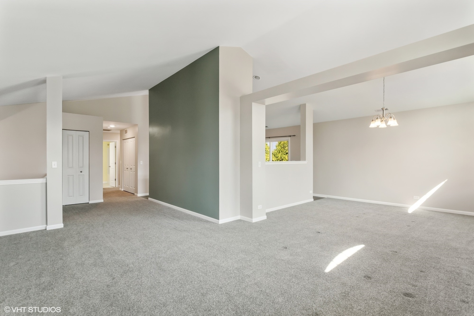 1724 Fredericksburg Lane Aurora, IL 60503 - Photo 5 of 20 an empty room with windows and entrance to other room