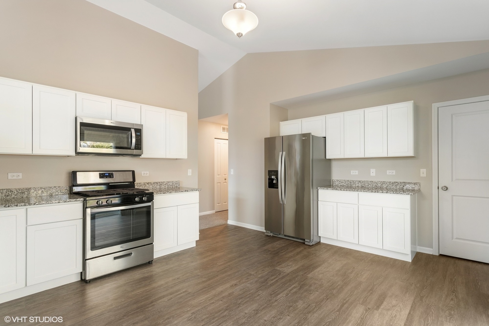1724 Fredericksburg Lane Aurora, IL 60503 - Photo 6 of 20 a kitchen with granite countertop a refrigerator stove and sink