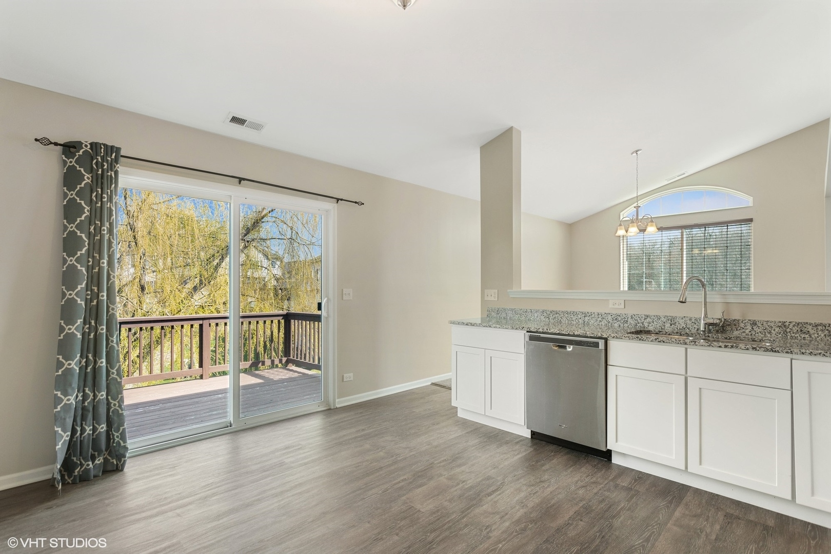 1724 Fredericksburg Lane Aurora, IL 60503 - Photo 8 of 20 a view of granite countertop kitchen with granite countertop a large window and a sink