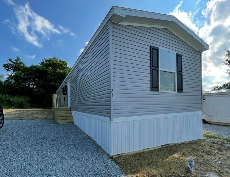 141 Wisebecker Lane Lot23a Monongahela, PA 15063 - Photo 1 of 11 a view of backyard of house and car parked