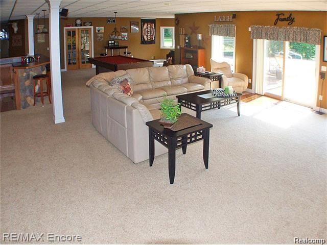 8629 Sashabaw Road Clarkston, MI 48348 - Photo 21 of 34 Family room is the recreation room. Space for the theatre and walk out to the patio/pool area