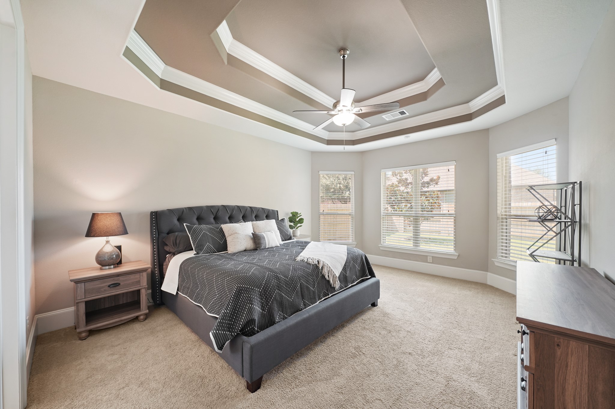 4210 Dalea Clover Lane Manvel, TX 77578 - Photo 14 of 38 a spacious bedroom with a bed couch and a large window