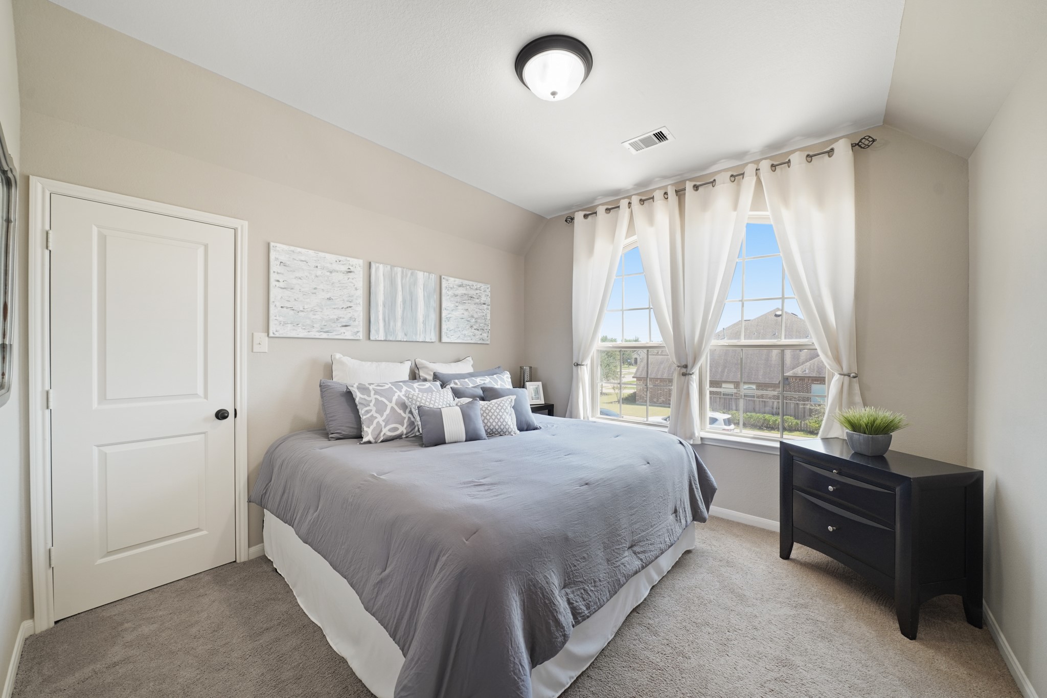 4210 Dalea Clover Lane Manvel, TX 77578 - Photo 25 of 38 a bedroom with a bed and a large window