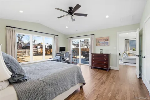 a bed room with a bed window and a chair