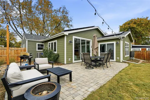 a patio with patio a couch and chairs