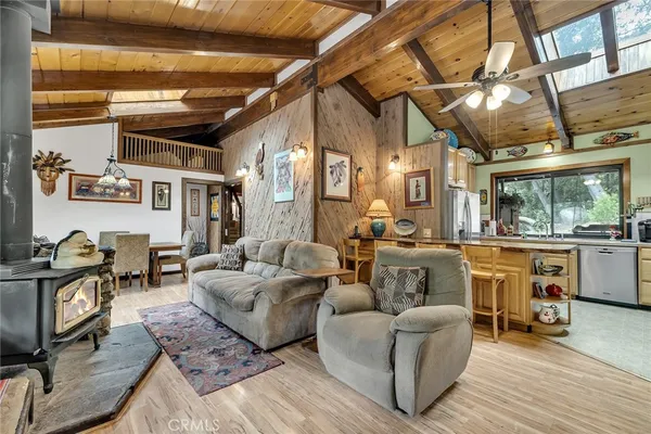 a living room with furniture a large window