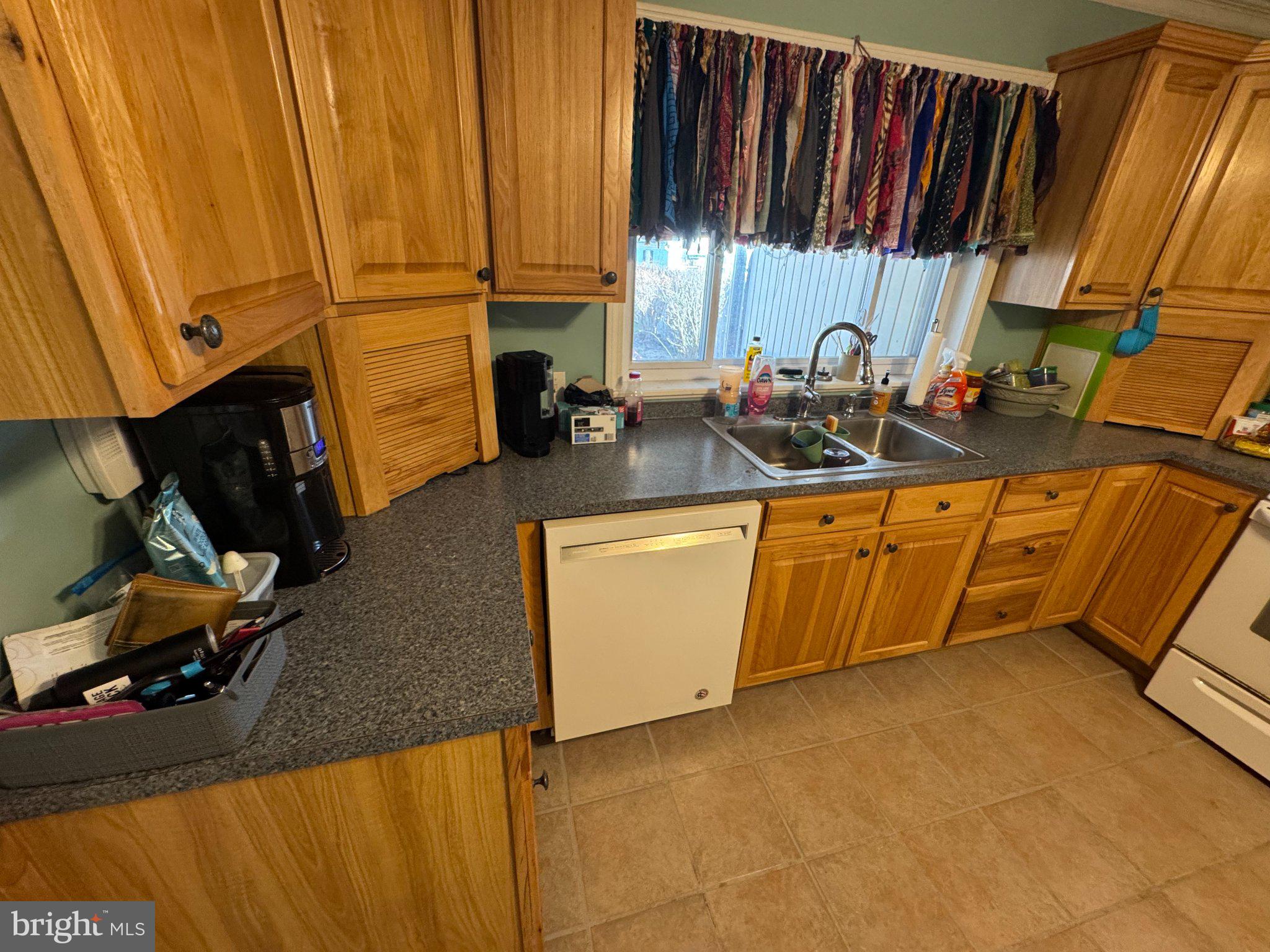 1319 Washington Street Huntingdon, PA 16652 - Photo 6 of 20 Warm wooden kitchen with vibrant decor.