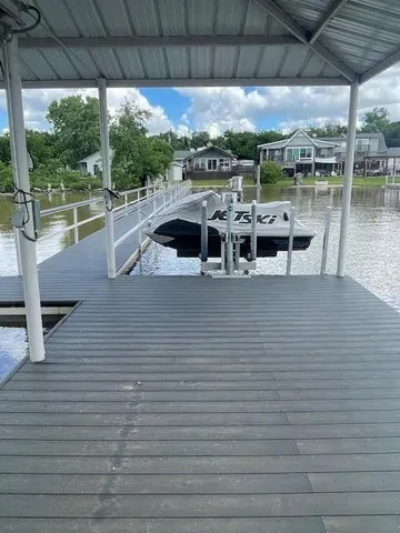 a view of a swimming pool with outdoor seating