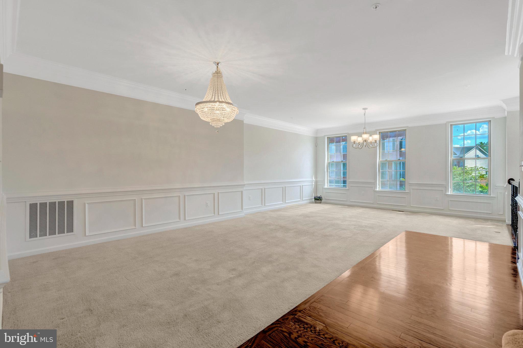 42634 Lancaster Ridge Terrace Chantilly, VA 20152 - Photo 13 of 63 a view of an empty room with wooden floor and a window