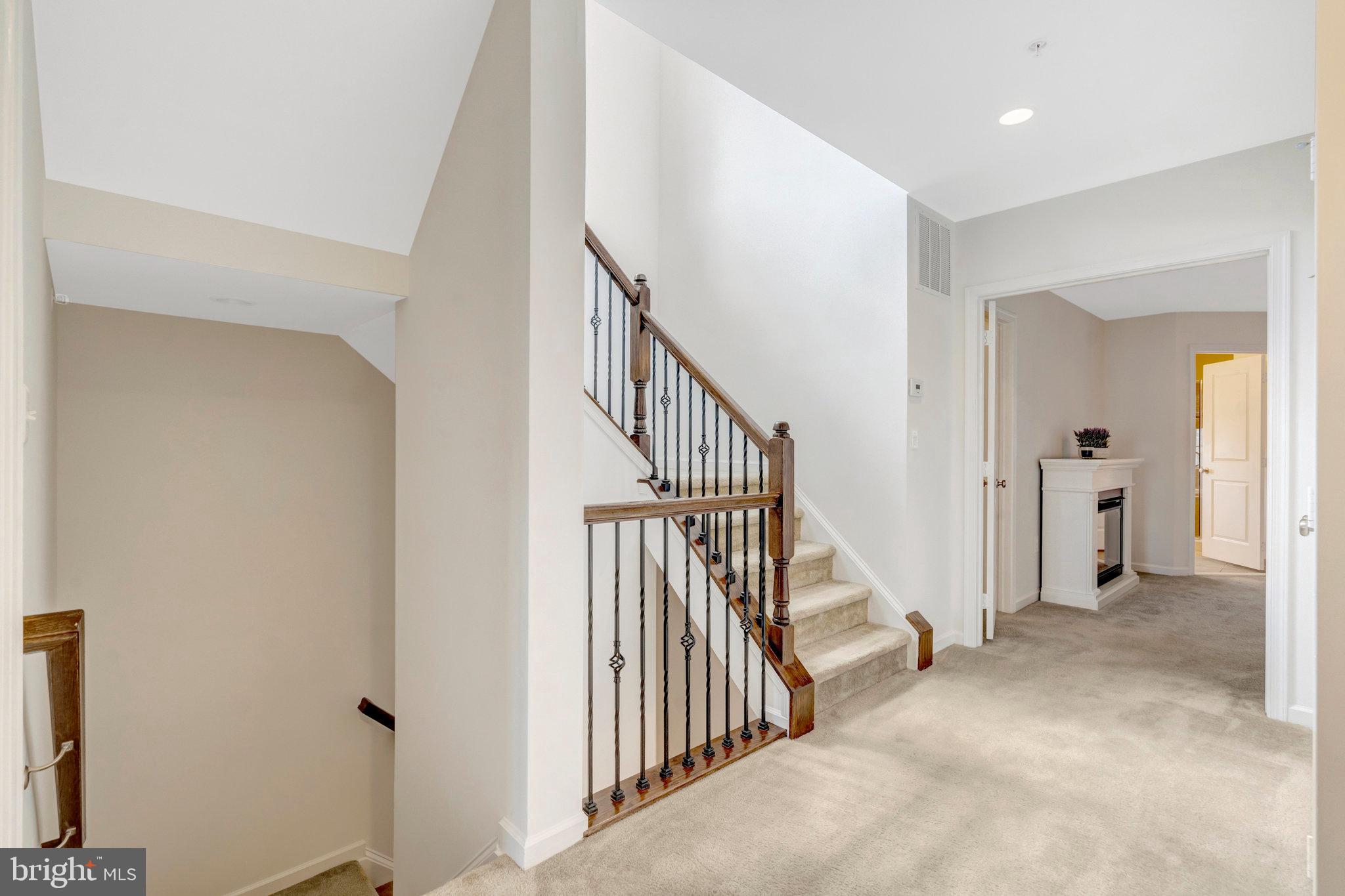 42634 Lancaster Ridge Terrace Chantilly, VA 20152 - Photo 26 of 63 a view of a hallway with staircase