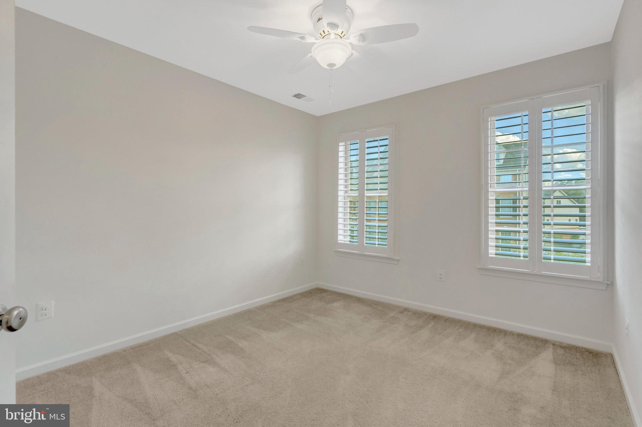 42634 Lancaster Ridge Terrace Chantilly, VA 20152 - Photo 29 of 63 an empty room with a window and a fan