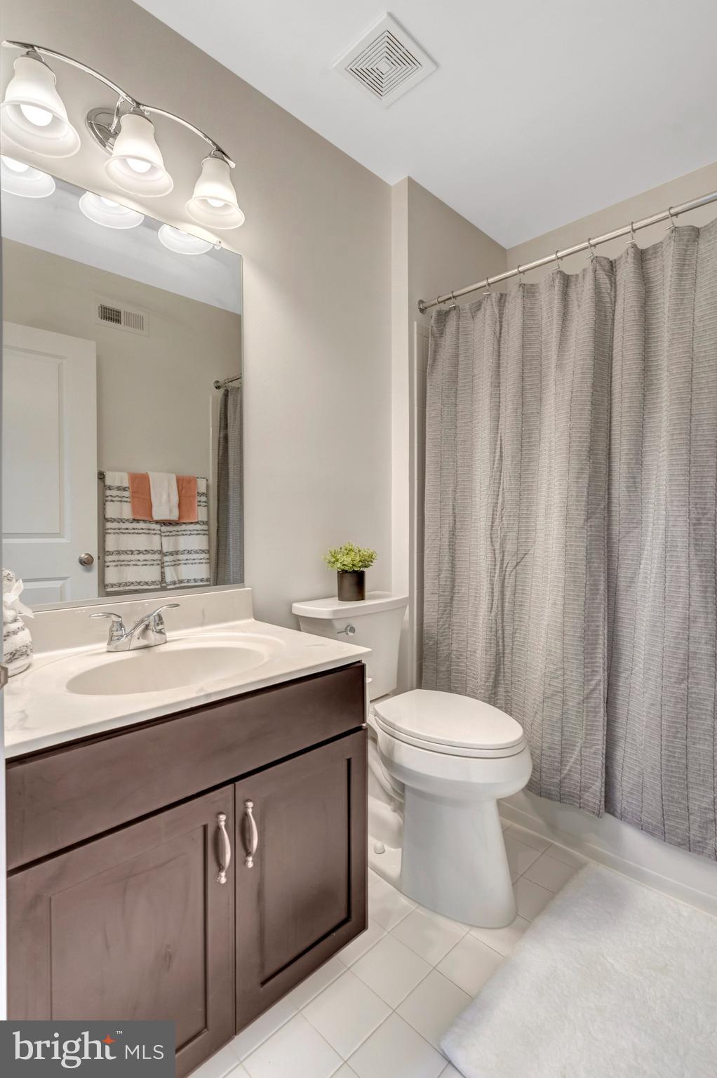42634 Lancaster Ridge Terrace Chantilly, VA 20152 - Photo 32 of 63 a bathroom with a sink a toilet and shower
