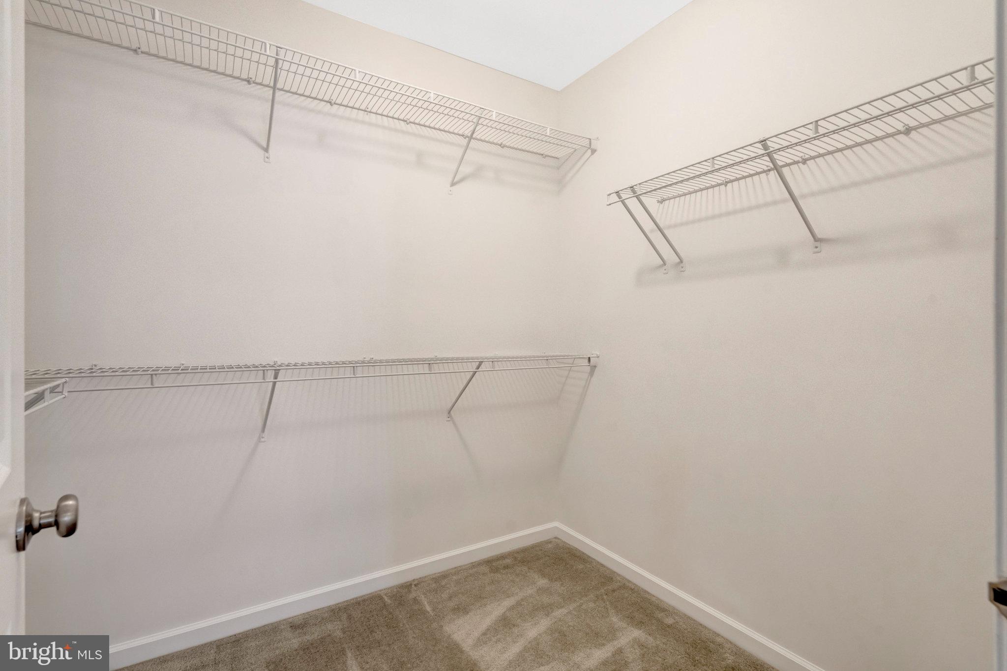 42634 Lancaster Ridge Terrace Chantilly, VA 20152 - Photo 37 of 63 a view of a room with racks on the wall