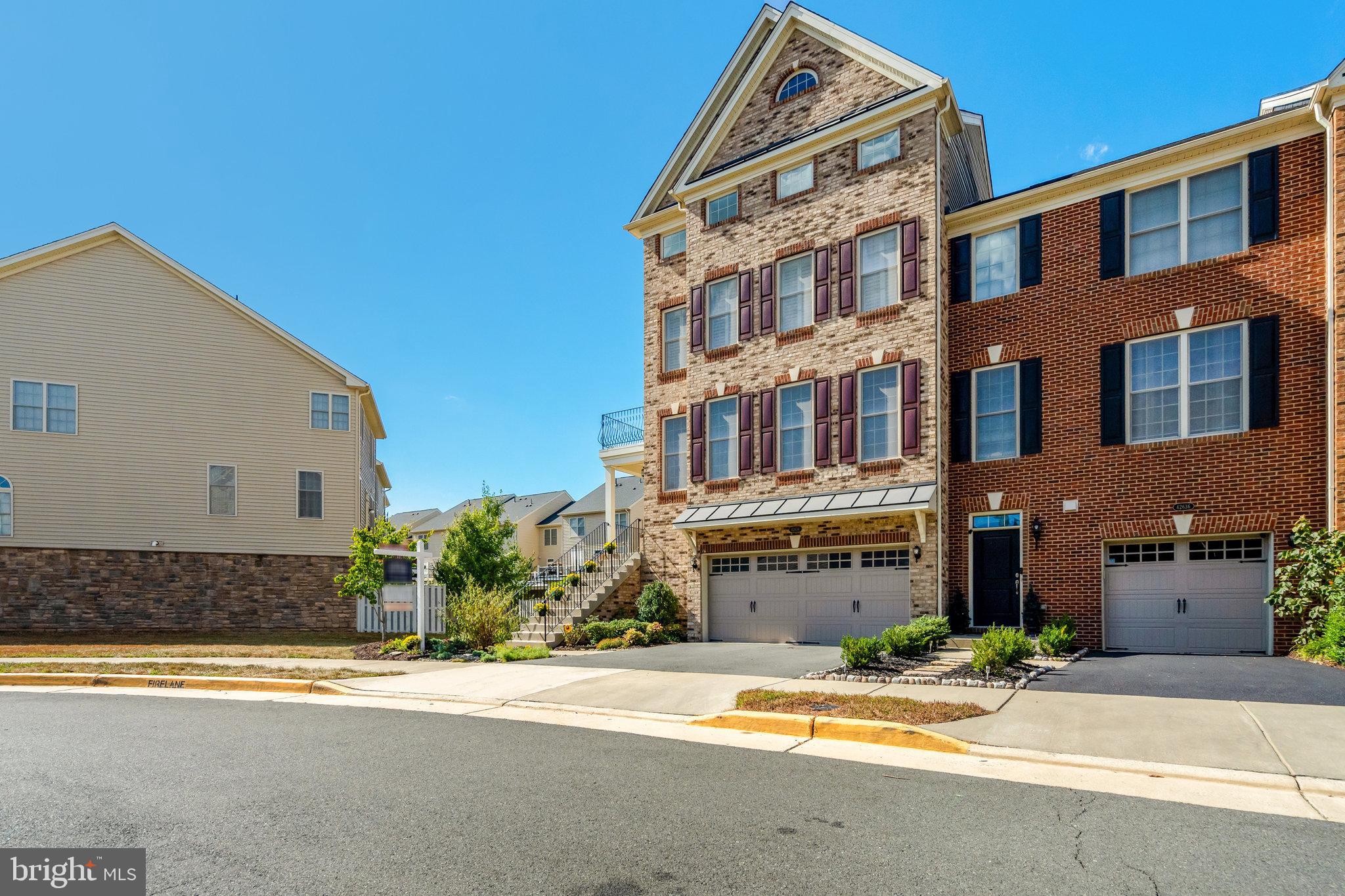 42634 Lancaster Ridge Terrace Chantilly, VA 20152 - Photo 4 of 63 a view of a building with a street