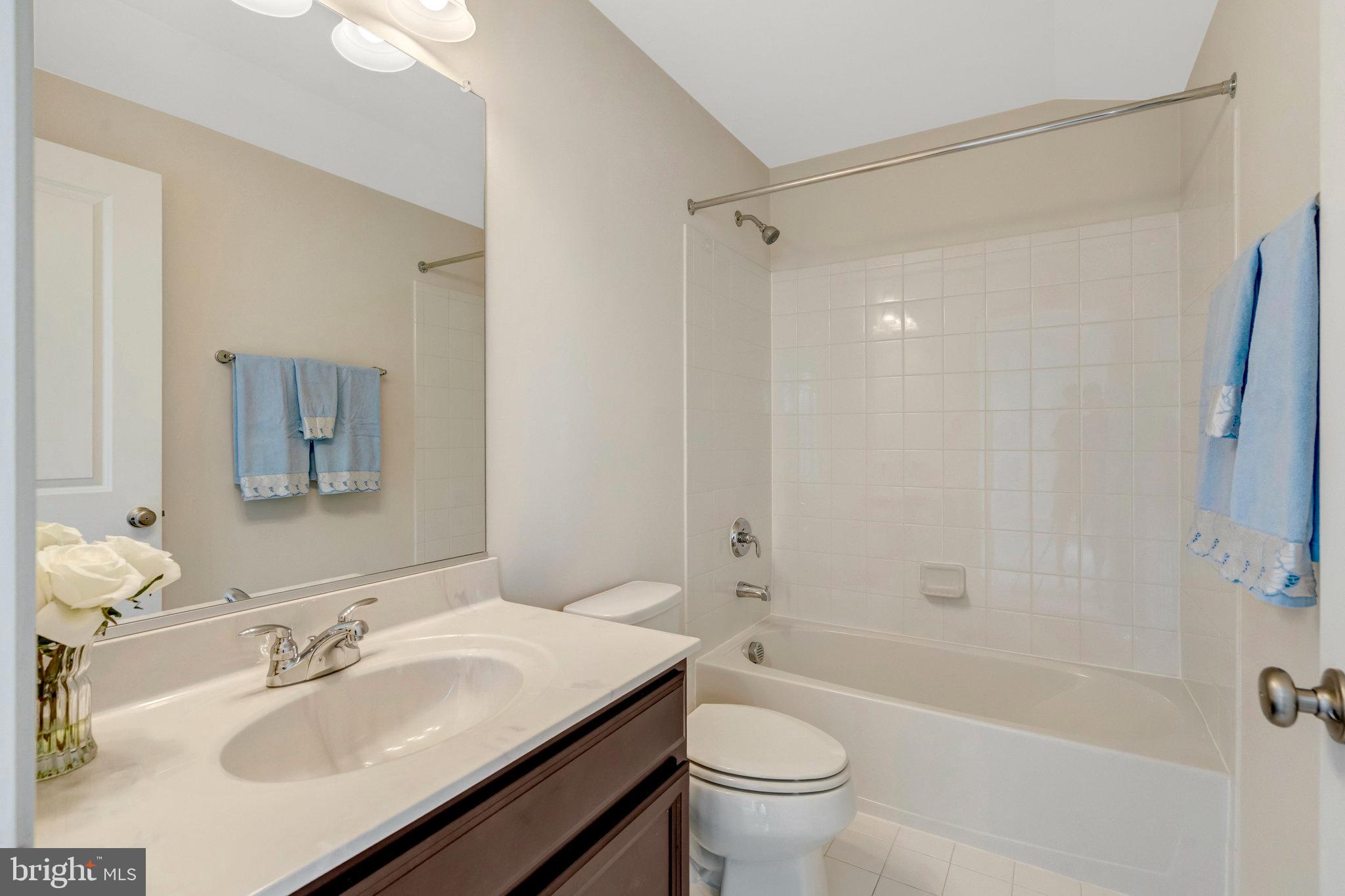 42634 Lancaster Ridge Terrace Chantilly, VA 20152 - Photo 47 of 63 a bathroom with a sink toilet tub and shower